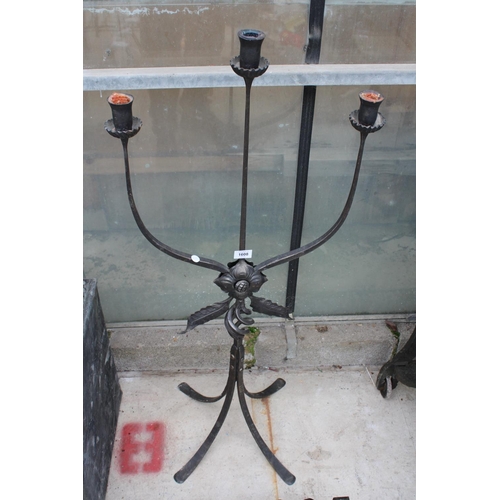 1608 - A DECORATIVE THREE BRANCH METAL CANDLESTICK