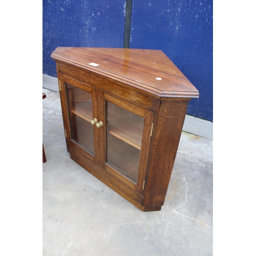 2504 - A GORDON WARR CONTRASTING HARDWOOD COFFEE TABLE AND AN OAK CORNER CABINET