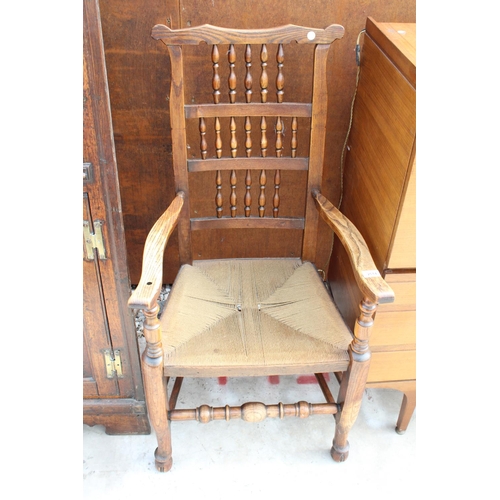 2514 - AN 18TH CENTURY STYLE ELM SPINDLE-BACK CARVER CHAIR WITH RUSH SEAT