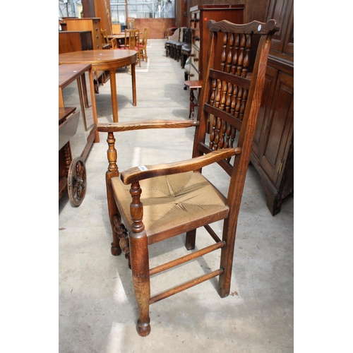 2514 - AN 18TH CENTURY STYLE ELM SPINDLE-BACK CARVER CHAIR WITH RUSH SEAT