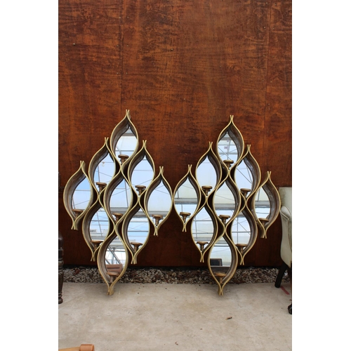 2521 - A PAIR OF MODERN PIERCED METALWARE MIRRORED RAINDROP MIRRORS WITH CANDLE HOLDERS