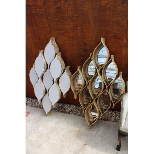 2521 - A PAIR OF MODERN PIERCED METALWARE MIRRORED RAINDROP MIRRORS WITH CANDLE HOLDERS