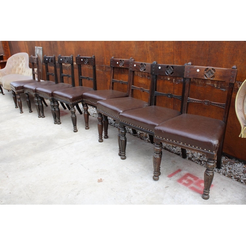 2522 - A SET OF 8 VICTORIAN OAK DINING CHAIRS WITH CARVED TOP RAIL ON TURNED AND FLUTED LEGS