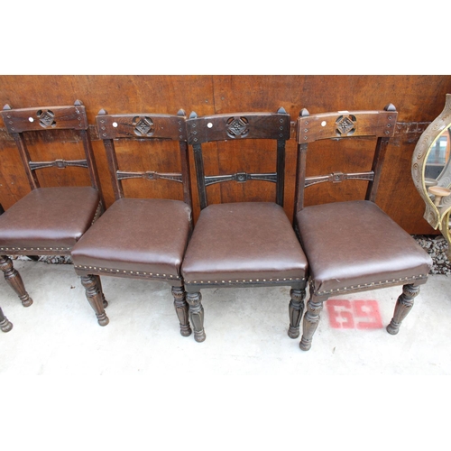 2522 - A SET OF 8 VICTORIAN OAK DINING CHAIRS WITH CARVED TOP RAIL ON TURNED AND FLUTED LEGS