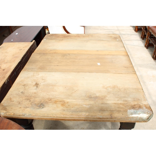 2553 - A LATE VICTORIAN SCRUB TOP WIND-OUT DINING TABLE WITH CANTED CORNERS ON TURNED AND FLUTED LEGS