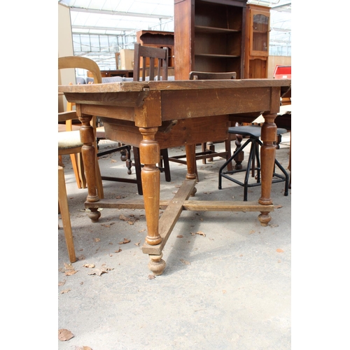 2568 - A CONTINENTAL MID 20TH CENTURY DINING TABLE WITH SINGLE DRAWER