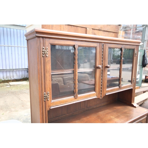 2576 - AN OAK AND BEECH E.GOMME FURNITURE DRESSER WITH GLAZED UPPER PORTION 55