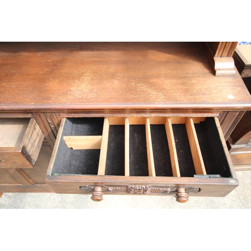 2576 - AN OAK AND BEECH E.GOMME FURNITURE DRESSER WITH GLAZED UPPER PORTION 55