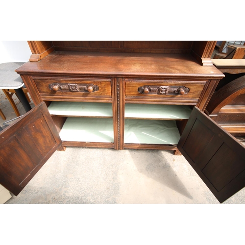 2576 - AN OAK AND BEECH E.GOMME FURNITURE DRESSER WITH GLAZED UPPER PORTION 55