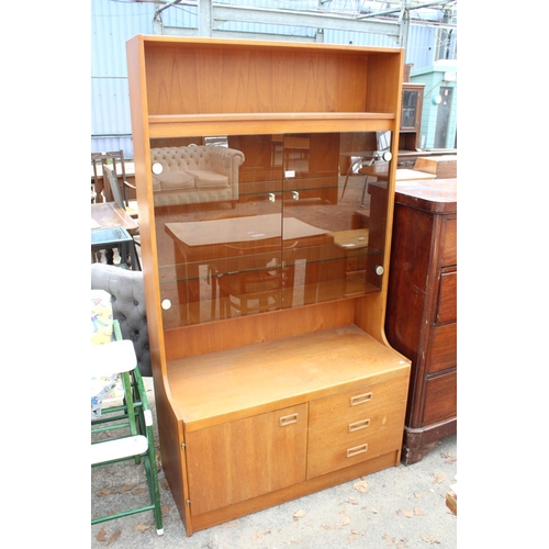 2730 - A RETRO TEAK UNIT WITH SMOKED GLASS DOORS, CUPBOARD AND DRAWERS TO BASE. 39.5