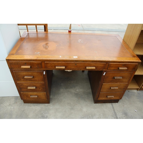 2773 - A MID 20TH CENTURY OAK TWIN PEDESTAL DESK ENCLOSING 8 DRAWERS, 54