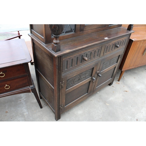 2782 - AN OAK JACOBEAN STYLE COURT CUPBOARD WITH GLAZED AND LEADED UPPER PORTION, 54