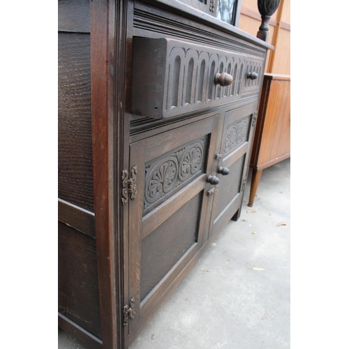 2782 - AN OAK JACOBEAN STYLE COURT CUPBOARD WITH GLAZED AND LEADED UPPER PORTION, 54