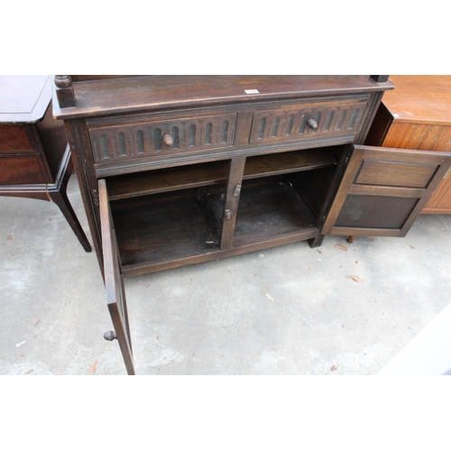 2782 - AN OAK JACOBEAN STYLE COURT CUPBOARD WITH GLAZED AND LEADED UPPER PORTION, 54