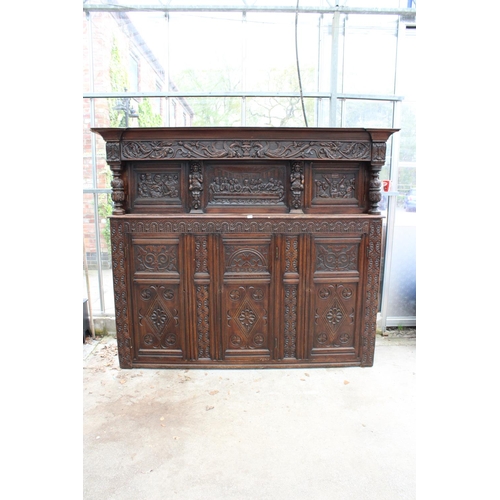 2799 - AN OAK GEORGE III STYLE COURT CUPBOARD WITH CARVED PANELS, THREE DEPICTING THE BIRTH AND CRUXIFICTIO...