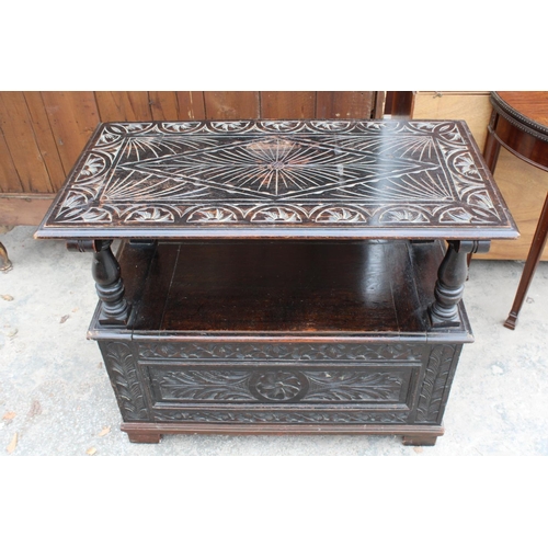 2801 - AN EARLY 20TH CENTURY OAK MONKS BENCH WITH CARVED PANELS