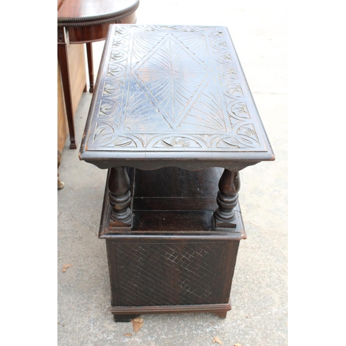 2801 - AN EARLY 20TH CENTURY OAK MONKS BENCH WITH CARVED PANELS