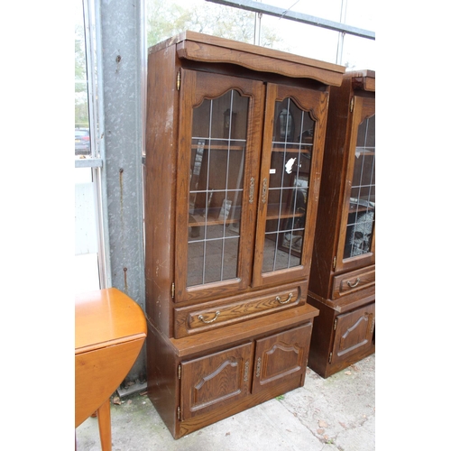 2803 - A MODERN OAK CABINET WITH GLAZED AND LEADED UPPER PORTION, 37