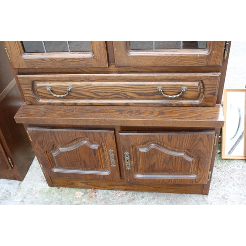 2804 - A MODERN OAK CABINET WITH GLAZED AND LEADED UPPER PORTION, 37