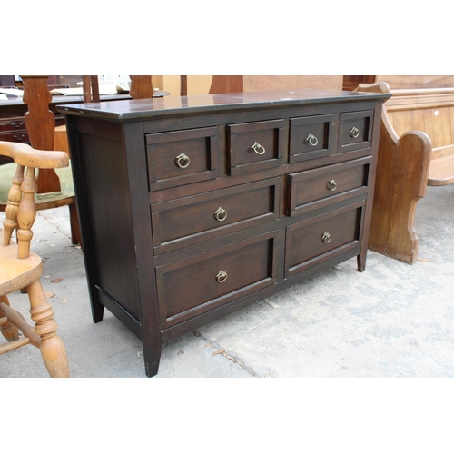 2811 - A MODERN HARDWOOD SIDEBOARD ENCLOSING 4 SHORT AND 4 LONG DRAWERS, 47