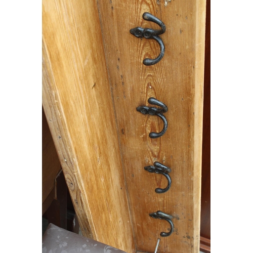 2821 - A PINE WALL SHELF INCORPORATING FOUR PAIRS OF COAT HOOKS