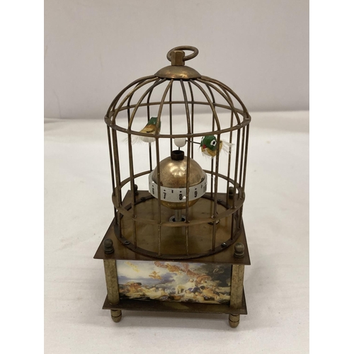 14 - A BRASS MECHANICAL BIRD CAGE CLOCK SEEN WORKING BUT NO WARRANTY