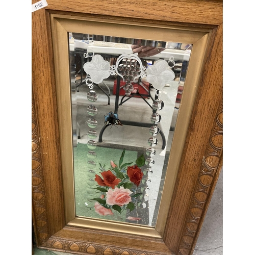 16 - TWO OAK FRAMED DECORATIVE MIRRORS WITH FLOWERS AND BUTTERFLIES 20