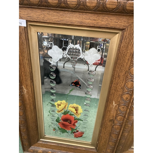 16 - TWO OAK FRAMED DECORATIVE MIRRORS WITH FLOWERS AND BUTTERFLIES 20