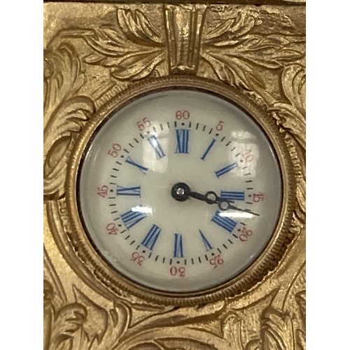 18 - A MINIATURE GILDED FRENCH CLOCK WITH KEY HEIGHT 3.5