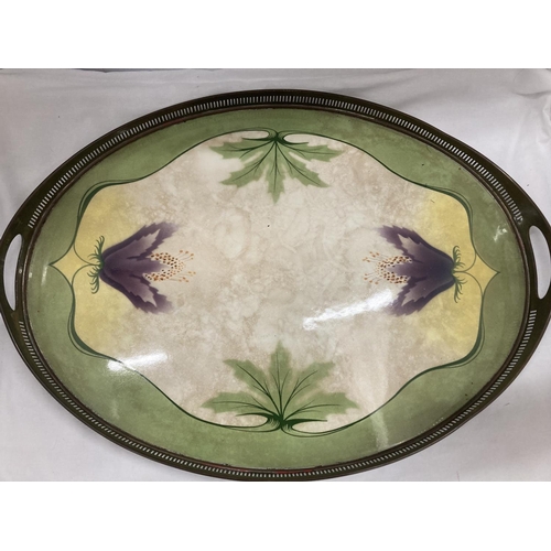 37 - AN ART NOUVEAU STYLE  BRASS AND CERAMIC TRAY WITH GALLERIED SIDES ADORNED WITH FLOWERS AND LEAVES CR... 