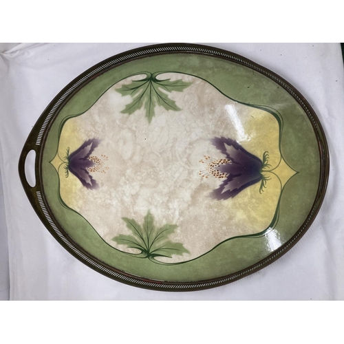 37 - AN ART NOUVEAU STYLE  BRASS AND CERAMIC TRAY WITH GALLERIED SIDES ADORNED WITH FLOWERS AND LEAVES CR... 