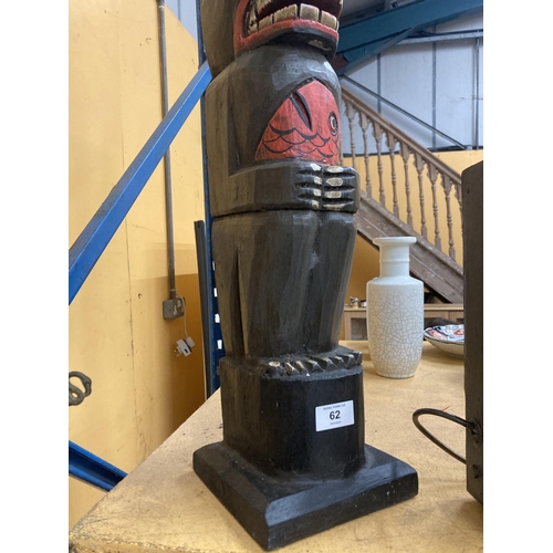 62 - A CARVED WOODEN TOTEM POLE