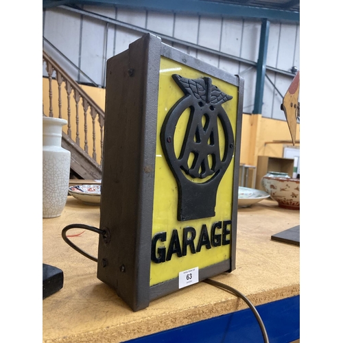 63 - AN AA GARAGE ILLUMINATED LIGHT BOX SIGN