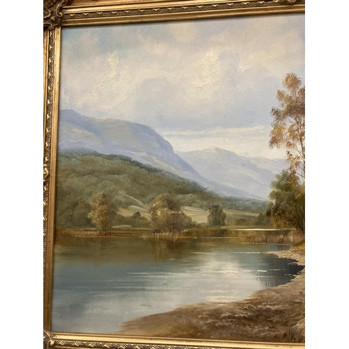 88 - A GILT FRAMED OIL ON CANVAS OF A LAKE SCENE WITH A FARMER MOVING STOCK SIGNED JACK R MOULD TO LOWER ... 