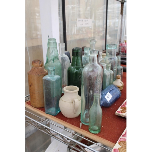 1617 - AN ASSORTMENT OF VINTAGE GLASS MEDICINE BOTTLES TO INCLUDE SOME BEARING NAMES