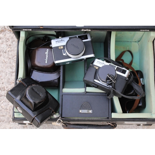 1637 - FIVE VARIOUS MINOLTA CAMERAS IN A CARRY CASE