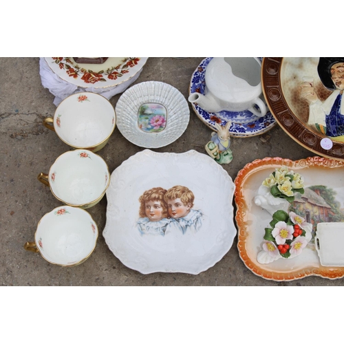 1814 - AN ASSORTMENT OF ITEMS TO INCLUDE CERAMIC PLATES, A CLOCK AND CUPS ETC