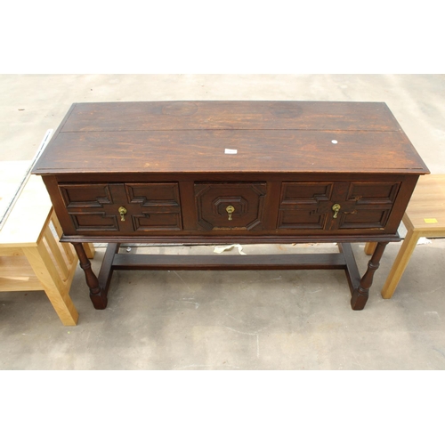 2852 - AN OAK JACOBEAN STYLE THREE DRAWER DRESSER BASE ON TURNED LEGS, 49.5