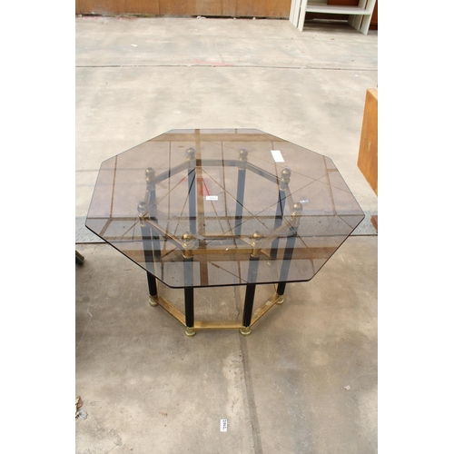 2855 - A RETRO OCTAGONAL SMOKED GLASS COFFEE TABLE ON BLACK AND BRASS EFFECT BASE