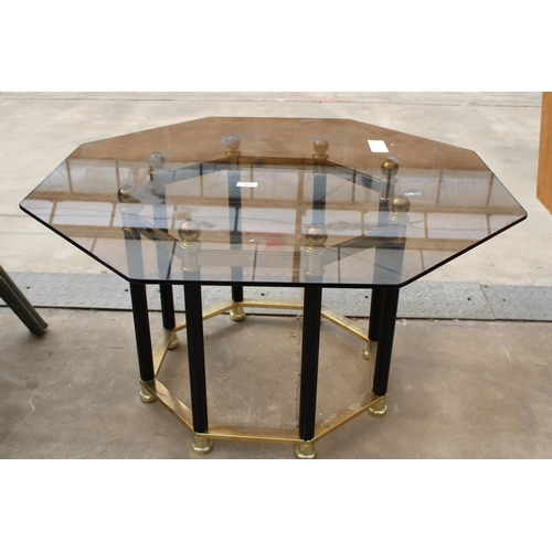 2855 - A RETRO OCTAGONAL SMOKED GLASS COFFEE TABLE ON BLACK AND BRASS EFFECT BASE