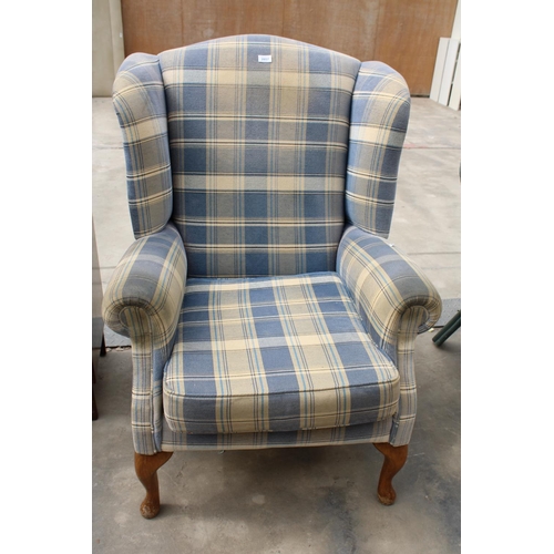 2857 - A MODERN CHECK WINGED FIRESIDE CHAIR ON FRONT CABRIOLE LEGS