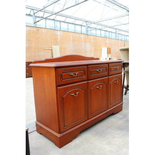 2861 - A MODERN CHERRY WOOD EFFECT SIDEBOARD ENCLOSING THREE DRAWERS AND THREE CUPBOARDS WITH RAISED BACK, ... 