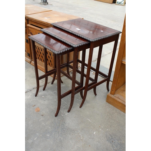 2872 - A MAHOGANY NEST OF THREE ROPE EDGE TABLES