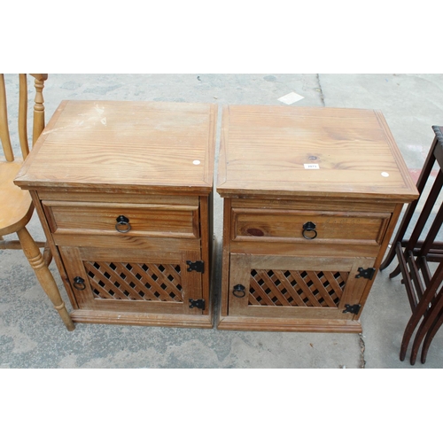 2873 - A PAIR OF MEXICAN PINE BEDSIDE CUPBOARDS WITH LATTICE WORK DOORS