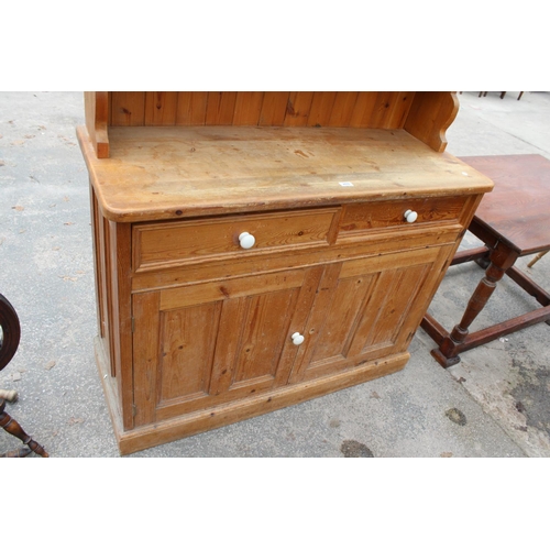 2876 - A MODERN PINE DRESSER WITH TWO DRAWERS AND CUPBOARD TO BASE AND PLATE RACK, 50