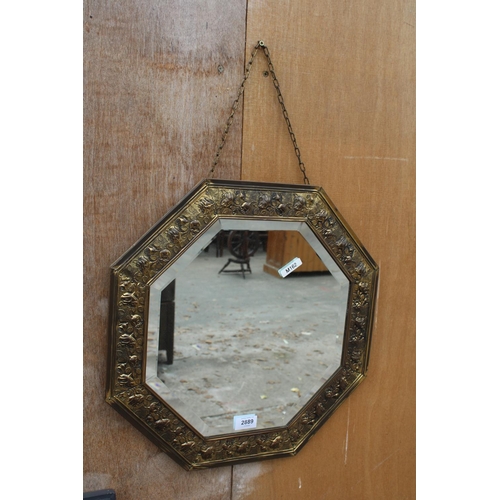 2889 - AN OCTAGONAL EMBOSSED BRASS BEVEL EDGE WALL MIRROR