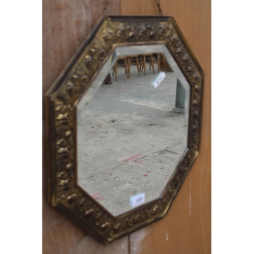 2889 - AN OCTAGONAL EMBOSSED BRASS BEVEL EDGE WALL MIRROR