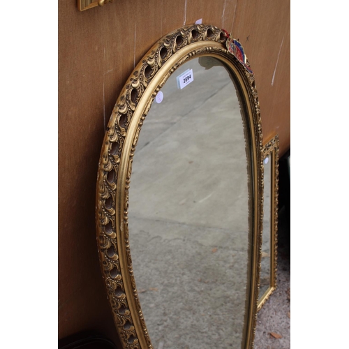 2894 - A MODERN GILT FRAMED PERRY OVERMAN (GLOVE) WALL MIRROR, 48