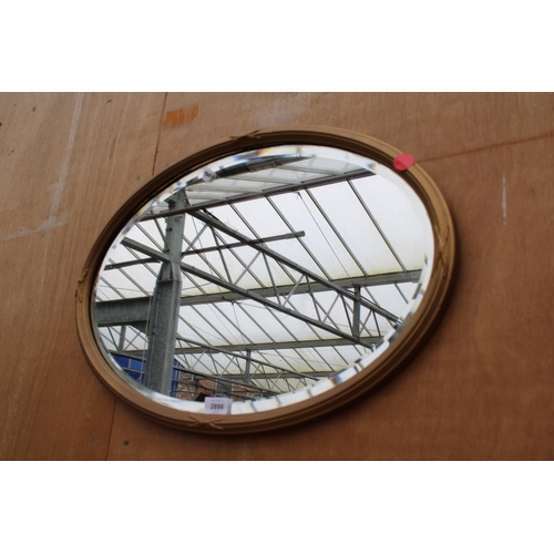 2898 - A MODERN OVAL BEVEL EDGE WALL MIRROR, 25