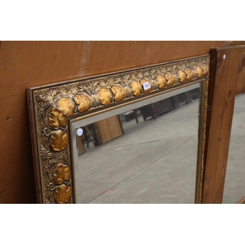 2899 - A MODERN GILT FRAMED WALL MIRROR WITH BEVEL EDGE AND FOLIATE DECORATION, 48